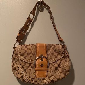 Tan Canvas and Leather Logo Coach Handbag with Silver Hardware.